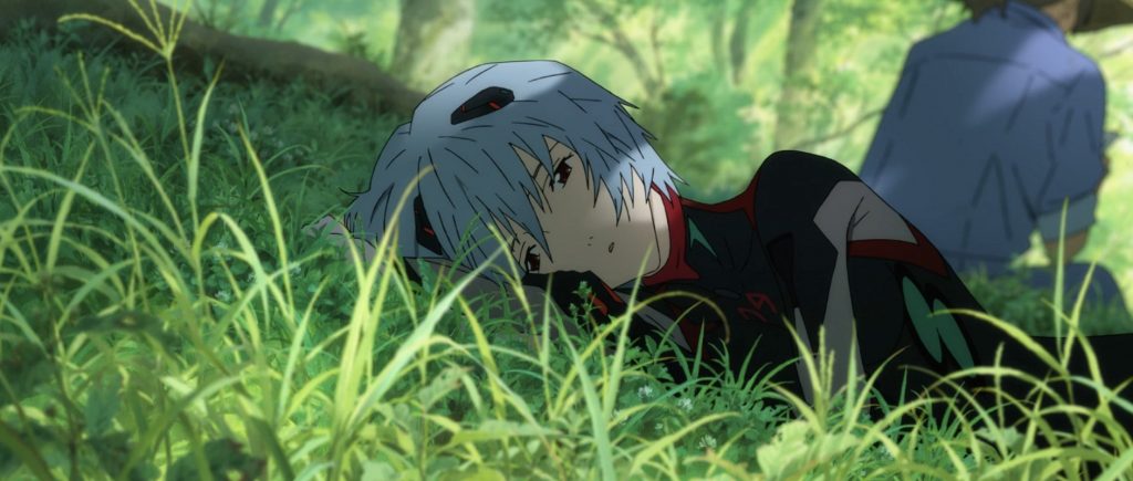 Rei from Evangelion in her skin tight plugsuit lays meditatively in the grass of the outdoors